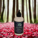 Bottle of Soap Witch Crafts product in a forest setting with autumn leaves