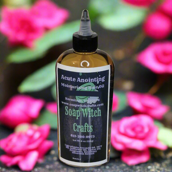 Bottle of Soap Witch Crafts Acute Anointing Moisturizing Hair Oil with a blurred forest background
